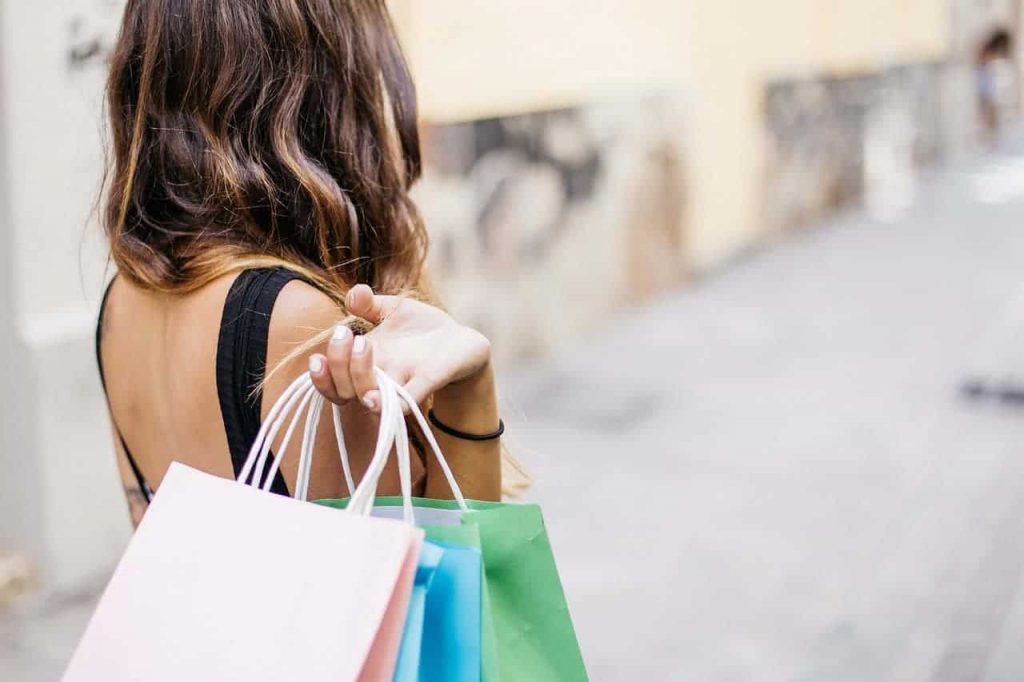 Woman with shopping bags as she goes impulse buying